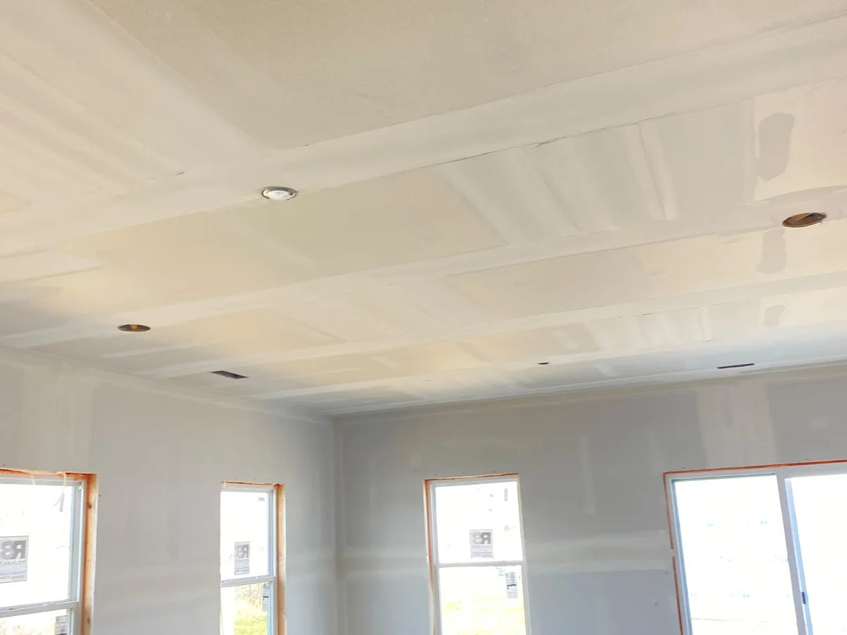 New-construction room hung and taped, ready for paint